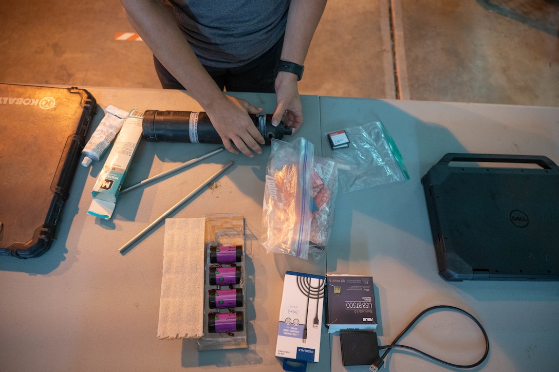 U.S. Army Corps of Engineers Sacramento District team member Ashley Lopez, environmental manager assembles equipment pieces used for the Juvenile Salmon Acoustic Telemetry System (JSATS) receivers that were used for a telemetry survey on Sept. 10, 2025, in Stockton, California. The U.S. Army Corps of Engineers Sacramento District conducts telemetry surveys to close critical data gaps on green sturgeon passage in the lower Sacramento River, providing valuable information to partner agencies for setting river flow requirements, managing dam releases, and improving the survival of  federally protected species. (U.S. Army photo by Bertha Smith, U.S. Army Corps of Engineers Sacramento District Public Affairs)