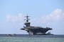 APRA HARBOR, Guam (Dec. 11, 2025) - Harbor tug boats guide Nimitz-class aircraft carrier USS Abraham Lincoln (CVN 72) as the ship pulls into Naval Base Guam for a scheduled port visit, Dec. 11. Abraham Lincoln Strike Group is on a scheduled deployment in the U.S. 7th Fleet area of operations to enhance interoperability through alliances and partnerships while serving as a ready-response force in support of a free and open Indo-Pacific region. 


(U.S. Navy photo by Valerie Maigue)