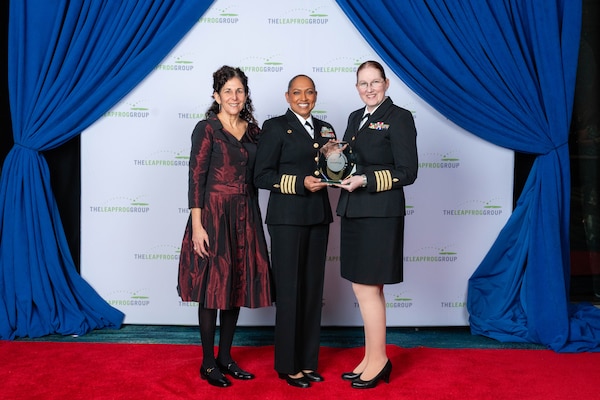 Naval Hospital Twentynine Palms Director Capt. Janiese Cleckley (center) and Chief Medical Officer Capt. Lisa Gibson (right) accept the Leapfrog Top Hospital award from Linda Schwimmer (left), chair of the board for the Leapfrog Group, during the Leapfrog Annual Meeting and Awards Dinner Dec. 15 at Gaylord National Harbor in Maryland. The recognition highlights the hospital’s commitment to patient safety, quality care and transparency in support of service members, retirees and their families. (Courtesy Photo)
