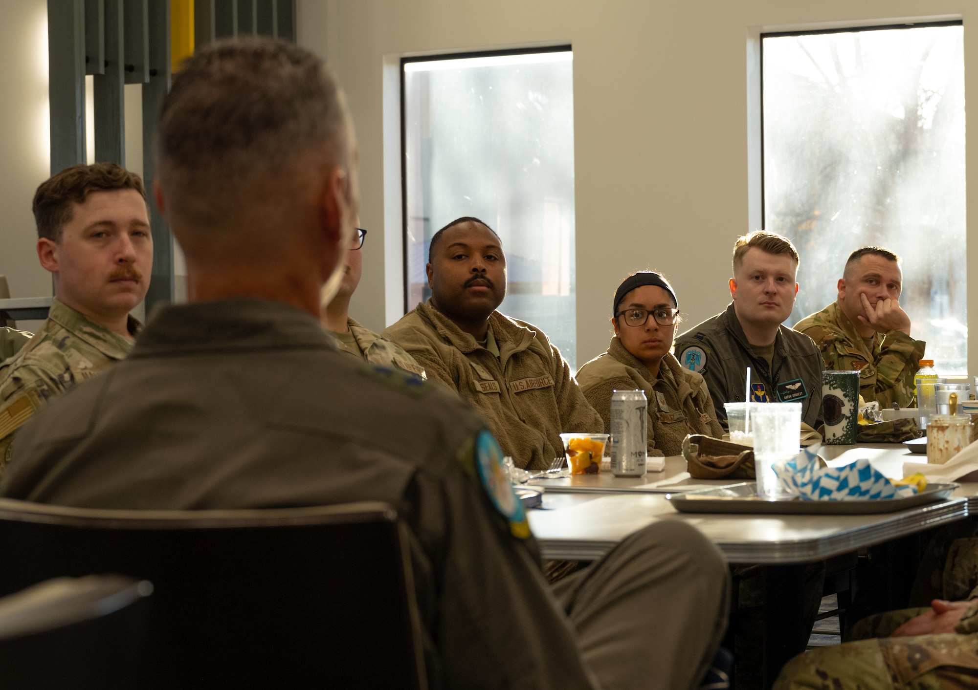 U.S. Air Force Maj. Gen. Gregory Kreuder, 19th Air Force commander, responds to questions from a group of 20 company grade officers and junior enlisted Airmen during a breakfast at the Shifting Sands Dining Facility on Holloman Air Force Base, New Mexico, Dec. 16, 2025.