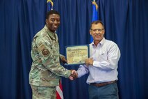 U.S. Air Force Maj. Christopher Parmer, 9th Munitions Squadron commander, poses for a photo with his honorary commander, John Jelavich, during the Beale Air Force Base Honorary Commander induction ceremony on August 1, 2025.
