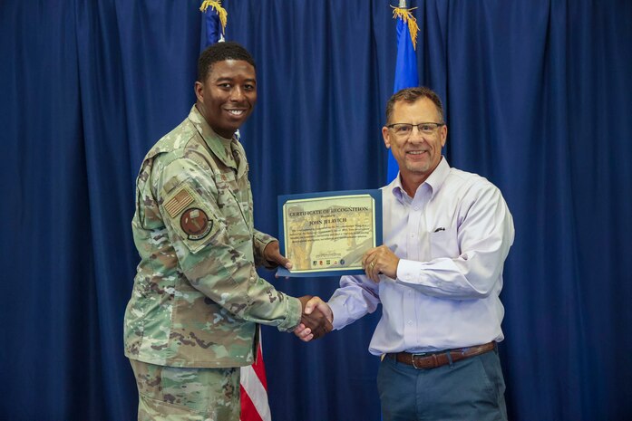 U.S. Air Force Maj. Christopher Parmer, 9th Munitions Squadron commander, poses for a photo with his honorary commander, John Jelavich, during the Beale Air Force Base Honorary Commander induction ceremony on August 1, 2025.