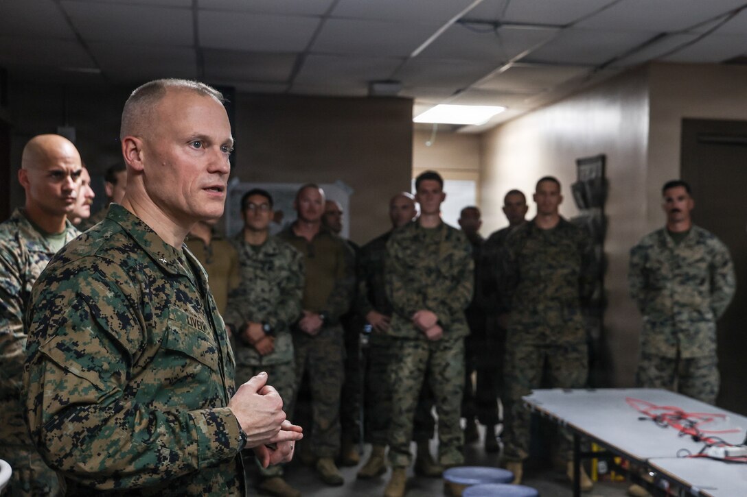 U.S. Marine Corps Brig. Gen. James W. Lively, commanding general of the 2nd Marine Expeditionary Brigade, addresses Marines with the 22nd Marine Expeditionary Unit (Special Operations Capable), during his visit to Camp Santiago, Puerto Rico, Dec. 16, 2025. U.S. military forces are deployed to the Caribbean in support of the U.S. Southern Command mission, Department of War-directed operations, and the president’s priorities to disrupt illicit drug trafficking and protect the homeland. (U.S. Marine Corps photo)