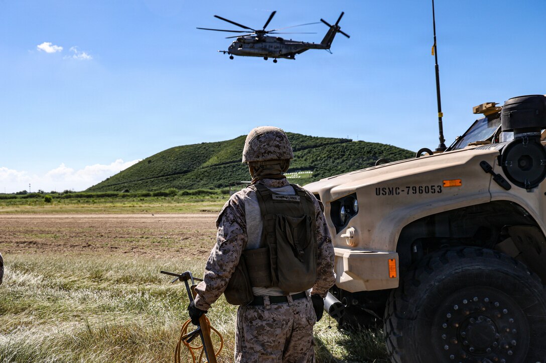 A U.S. Marine with Combat Logistics Battalion 26, 22nd Marine Expeditionary Unit (Special Operations Capable), prepares for helicopter support team training at Camp Santiago, Puerto Rico, Dec. 18, 2025. U.S. military forces are deployed to the Caribbean in support of the U.S. Southern Command mission, Department of War-directed operations, and the president’s priorities to disrupt illicit drug trafficking and protect the homeland. (U.S. Marine Corps photo)
