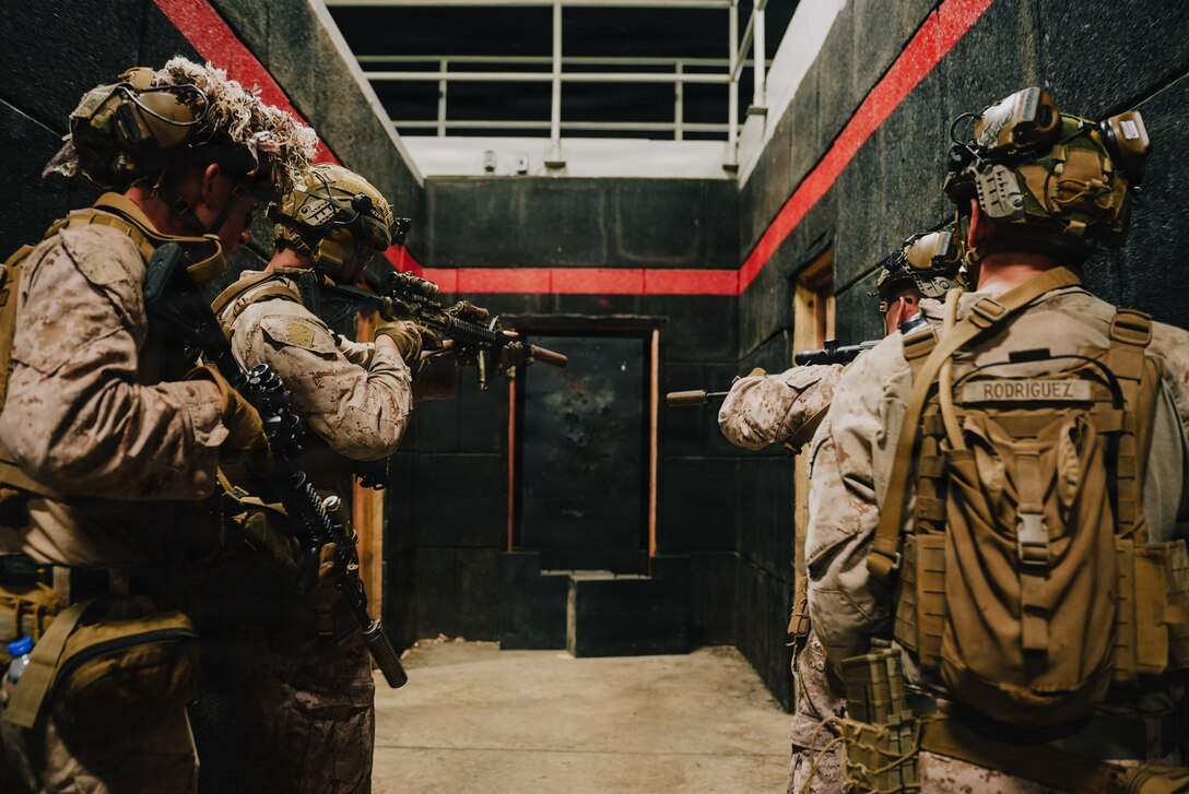 U.S. Marines with Kilo Company, Battalion Landing Team 3/6, 22nd Marine Expeditionary Unit (Special Operations Capable), conduct a dry-fire rehearsal before a close quarter battle live-fire exercise at Camp Santiago, Puerto Rico, Dec. 19, 2025. U.S. military forces are deployed to the Caribbean in support of the U.S. Southern Command mission, Department of War-directed operations, and the president's priorities to disrupt illicit drug trafficking and protect the homeland. (U.S. Marine Corps photo)