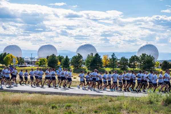 U.S. Service members run together