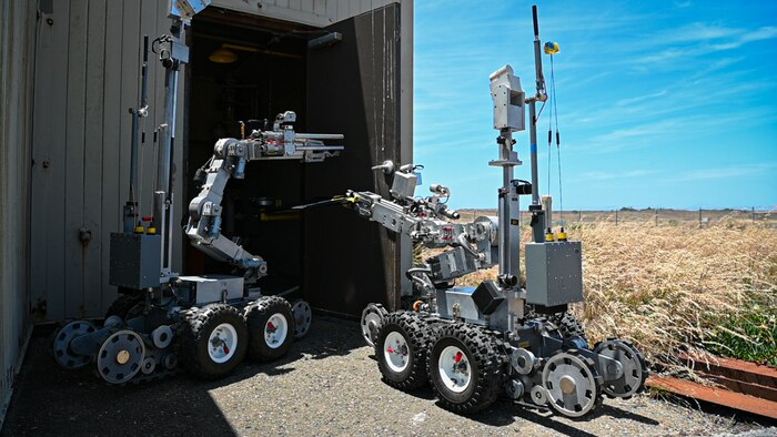 Two unmanned F6A Remote Ordnance Neutralization System robots
