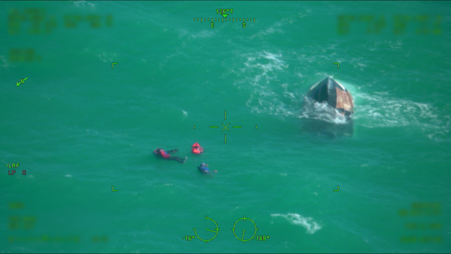 A U.S. Coast Guard rescue swimmer assists in the rescue of four survivors of a capsized vessel approximately 30 miles north of Key West, Florida, Dec. 31, 2025. An MH-60S Marlin helicopter crew from Naval Air Station Key West provided assistance with the rescue. (U.S. Coast Guard photo)