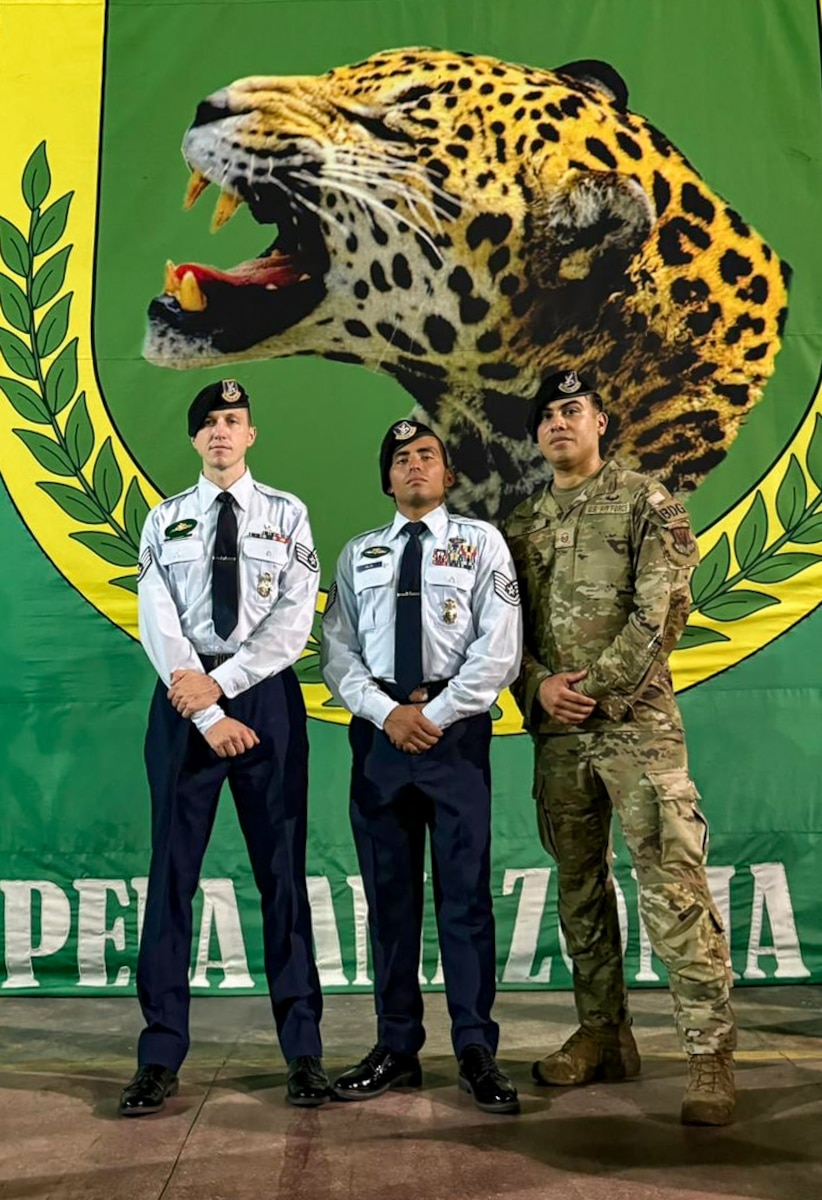 Airmen pose at Jungle Warfare School graduation.