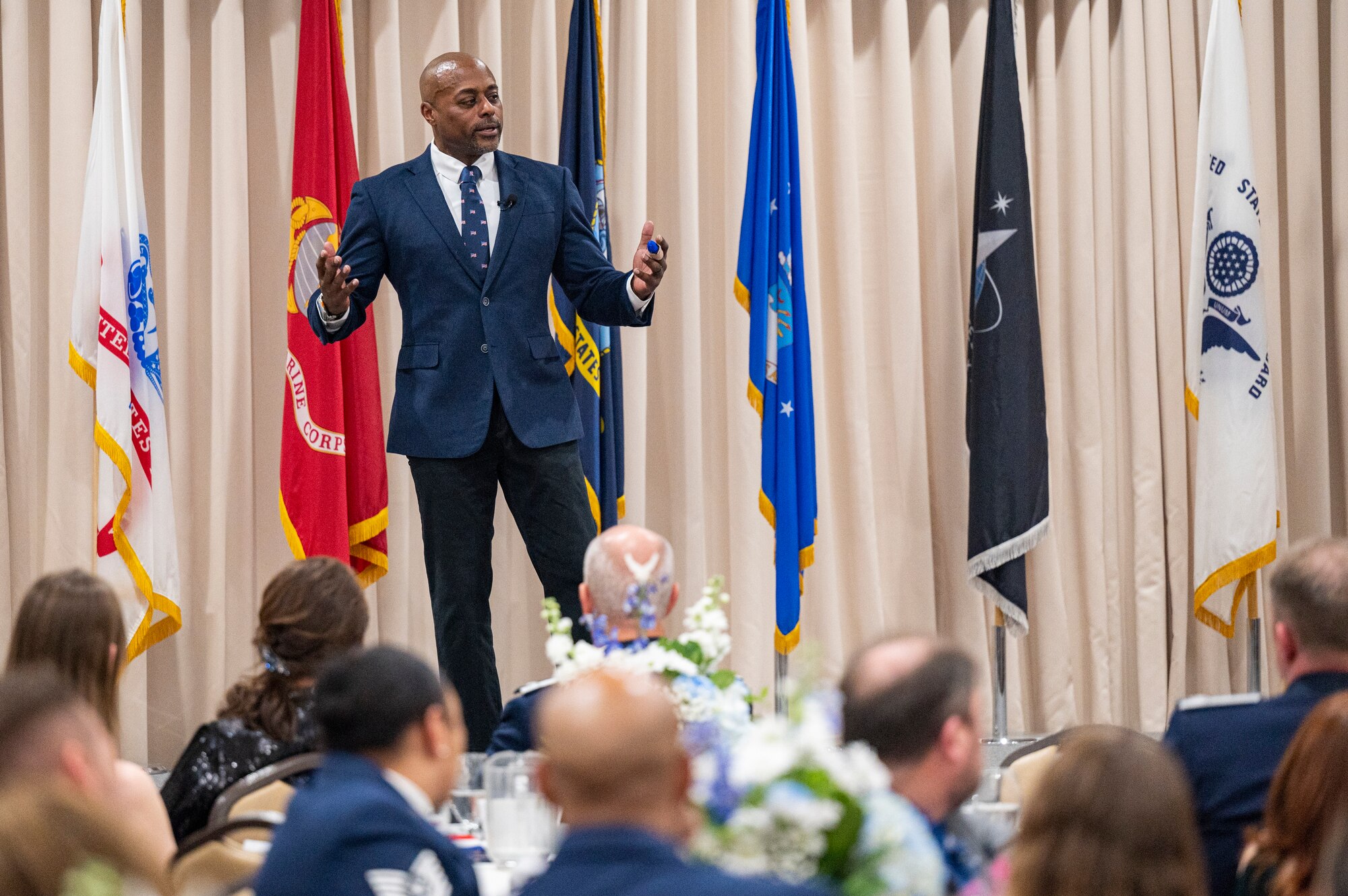 Corey Jones, a keynote speaker, addresses member of the 514th Air Mobility Wing during their Annual Awards Banquet on Joint Base McGuire-Dix-Lakehurst, N.J,. on Feb 1, 2025.