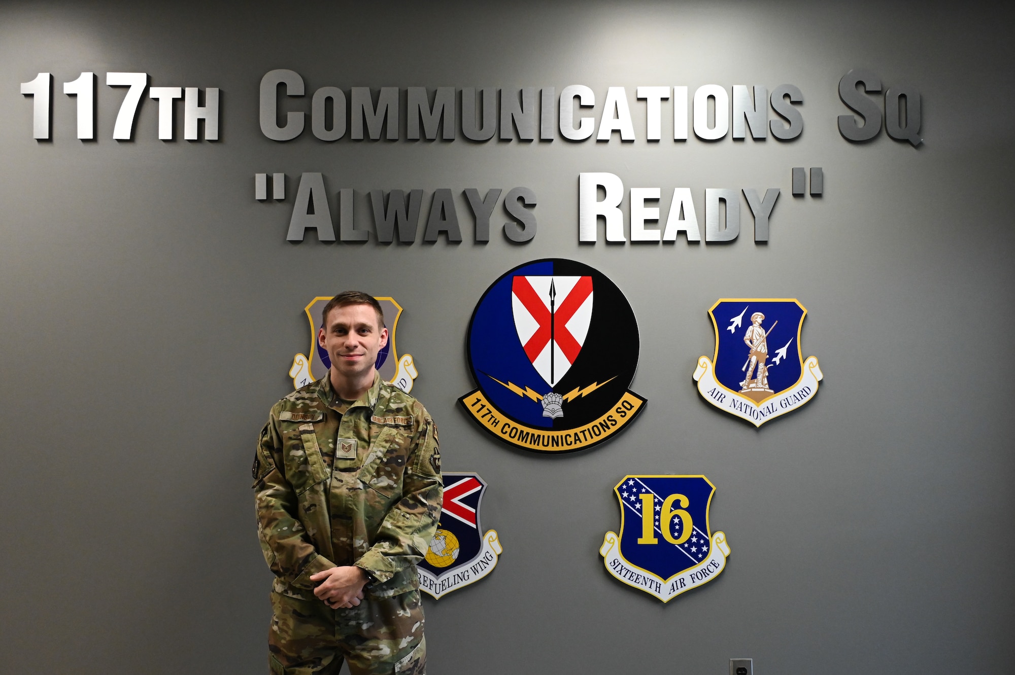 U.S. Air Force Tech. Sgt. Caleb Quinsey, a Client Systems Technician with the 117th Communications Squadron, smiles for a photo.