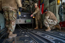 U.S. Air Force Airmen assigned to the 36th Airlift Squadron anchor a Bobtail Tractor in a C-130J Super Hercules in preparation of COPE NORTH 25 at Misawa Air Base, Japan, Jan. 29, 2025