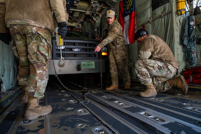 U.S. Air Force Airmen assigned to the 36th Airlift Squadron anchor a Bobtail Tractor in a C-130J Super Hercules in preparation of COPE NORTH 25 at Misawa Air Base, Japan, Jan. 29, 2025