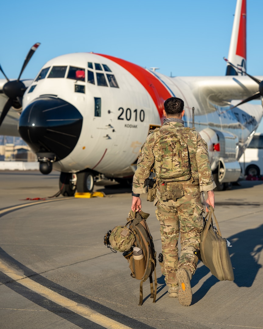 Coast Guard C-130 crew prepares aircraft for flight in support of Department of Homeland Security-led alien expulsion flights.