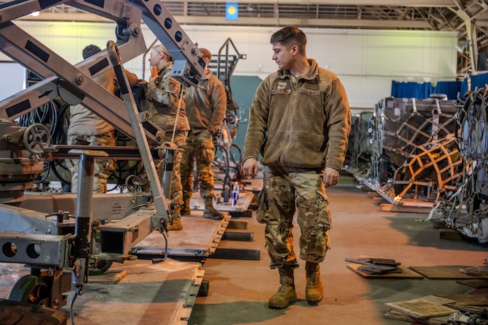 U.S. Air Force Staff Sgt. Joseph Reumont, 372 Training Squadron Detachment 23 field training instructor, inspects equipment during cargo preparation in support of Cope North 25 at Misawa Air Base, Japan, Jan. 24, 2025