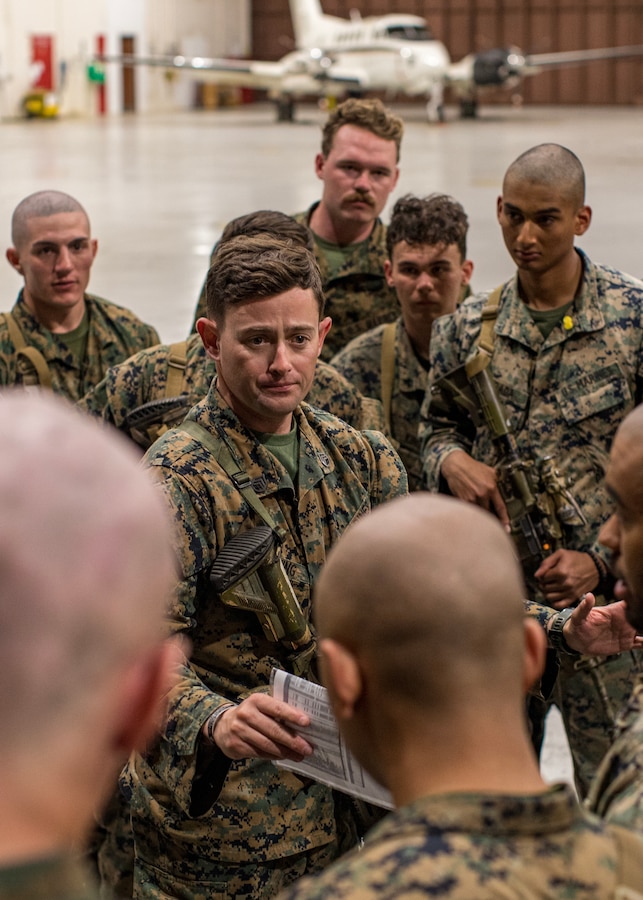 U.S. Marines with 1st Battalion, 6th Marine Regiment, 2d Marine Division discuss future operations at Naval Station Guantanamo Bay (NSGB), Cuba, Feb. 1, 2025. The Marines are deployed in support of the Department of Defense and Department of Homeland Security mission to expand the Migrant Operations Center at Naval Station Guantanamo Bay. (U.S. Navy photo by Jovi Prevot)