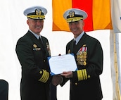Vice Adm. Jeffrey Anderson, commander, U.S. Sixth Fleet, presents Capt. Matthew Kiser with the Legion of Merit award during a change of command ceremony aboard the Blue Ridge-class command and control ship USS Mount Whitney (LCC 20). Mount Whitney, forward deployed from Gaeta, Italy, operates with a combined crew of U.S. Sailors and Military Sealift Command civil service mariners in the U.S. Sixth Fleet. The fleet operates in support of U.S. national security interests in Europe and Africa.