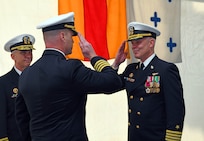 Capt. Colin Price, commanding officer of the Blue Ridge-class command and control ship USS Mount Whitney (LCC 20), salutes Capt. Matthew Kiser, during a change of command ceremony. Mount Whitney, forward deployed from Gaeta, Italy, operates with a combined crew of U.S. Sailors and Military Sealift Command civil service mariners in the U.S. Sixth Fleet. The fleet operates in support of U.S. national security interests in Europe and Africa.