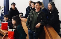 Megan Rawlings, right, daughter of fallen U.S. Army Solder Master Sgt. David Rawlings, watches the action with her boyfriend, Dallas Hunter, and children, 7-year-old Olivia and 5-year-old Easton Rawlings.