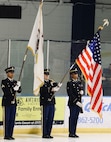 The Illinois Army National Guard's Military Funeral and Honors Team consisting of Spc. Kentrell Ceasear, Staff Sgt. Zachary Heath, Sgt. Deon Fairlee and Sgt. Chadd Boland presented the American Flag during the playing of the National Anthem at the North American Hockey League game between the Springfield (IL) Junior Blues and the Janesville (WI) Jets in Springfield, Illinois.