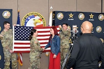 U.S. Army Maj. Lauren Hall, congratulates Sophie Marie Stewart at the conclusion of her Oath of Enlistment Ceremony, Jan. 29, 2025 at Redstone Arsenal, AL. In the foreground is Naji Shaheed, 2nd BDE Social Media Specialist capturing the moment for livestream viewers, and in the background are Stewart’s recruiters, Sgt. 1st Class Chuck Vandell and Staff Sgt. Chance Schutter from U.S. Army Recruiting Station Huntsville-Madison.