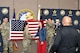 U.S. Army Maj. Lauren Hall, congratulates Sophie Marie Stewart at the conclusion of her Oath of Enlistment Ceremony, Jan. 29, 2025 at Redstone Arsenal, AL. In the foreground is Naji Shaheed, 2nd BDE Social Media Specialist capturing the moment for livestream viewers, and in the background are Stewart’s recruiters, Sgt. 1st Class Chuck Vandell and Staff Sgt. Chance Schutter from U.S. Army Recruiting Station Huntsville-Madison.