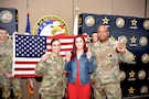 U.S. Army Col. Sherdrick Rankin, Commander, 2nd Recruiting Brigade and Maj. Lauren Hall, pose with new Army recruit, Sophie Marie Stewart at the conclusion of her Oath of Enlistment Ceremony on Jan. 29, 2025 at Redstone Arsenal, AL. Stewart enlisted as a 68T Animal Care Specialist in taking the first steps towards fulfilling her dream of a career in the medical field.