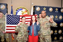 U.S. Army Col. Sherdrick Rankin, Commander, 2nd Recruiting Brigade and Maj. Lauren Hall, pose with new Army recruit, Sophie Marie Stewart at the conclusion of her Oath of Enlistment Ceremony on Jan. 29, 2025 at Redstone Arsenal, AL. Stewart enlisted as a 68T Animal Care Specialist in taking the first steps towards fulfilling her dream of a career in the medical field.