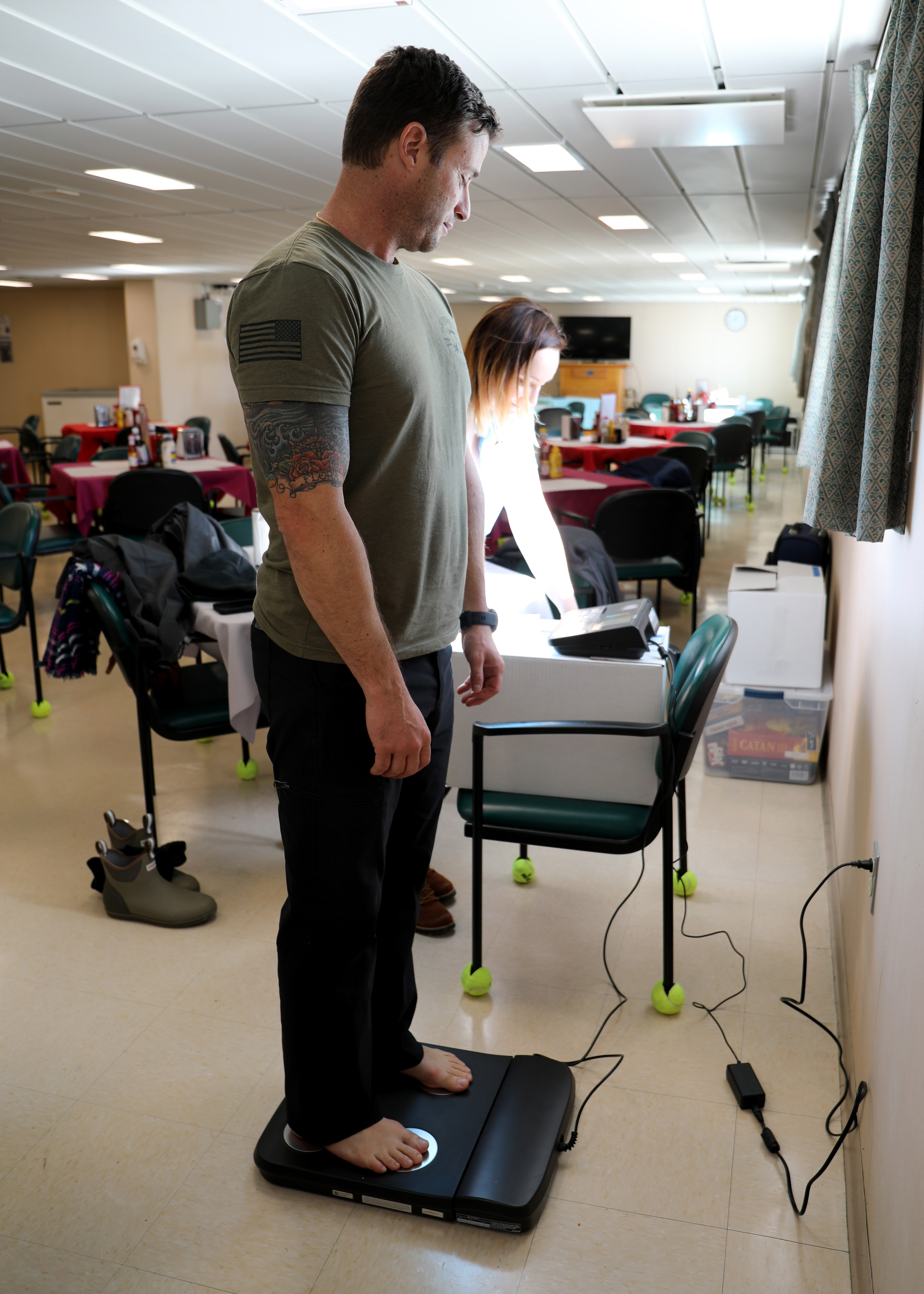 Capt. Adam Streeper, Master of Military Sealift Command's dry cargo ammunition ship USNS William McLean (T-AKE 12) receives a voluntary body composition screening administered by Stephanie Rusnak, MSC Resiliency Team/Health Promotion Coordinator, while the ship was pier-side on Naval Station Norfolk, Jan. 13. The screening was part of the MSC The Resiliency/Health Promotion Team's visit to the ship to assist with crew resiliency aboard the ship.