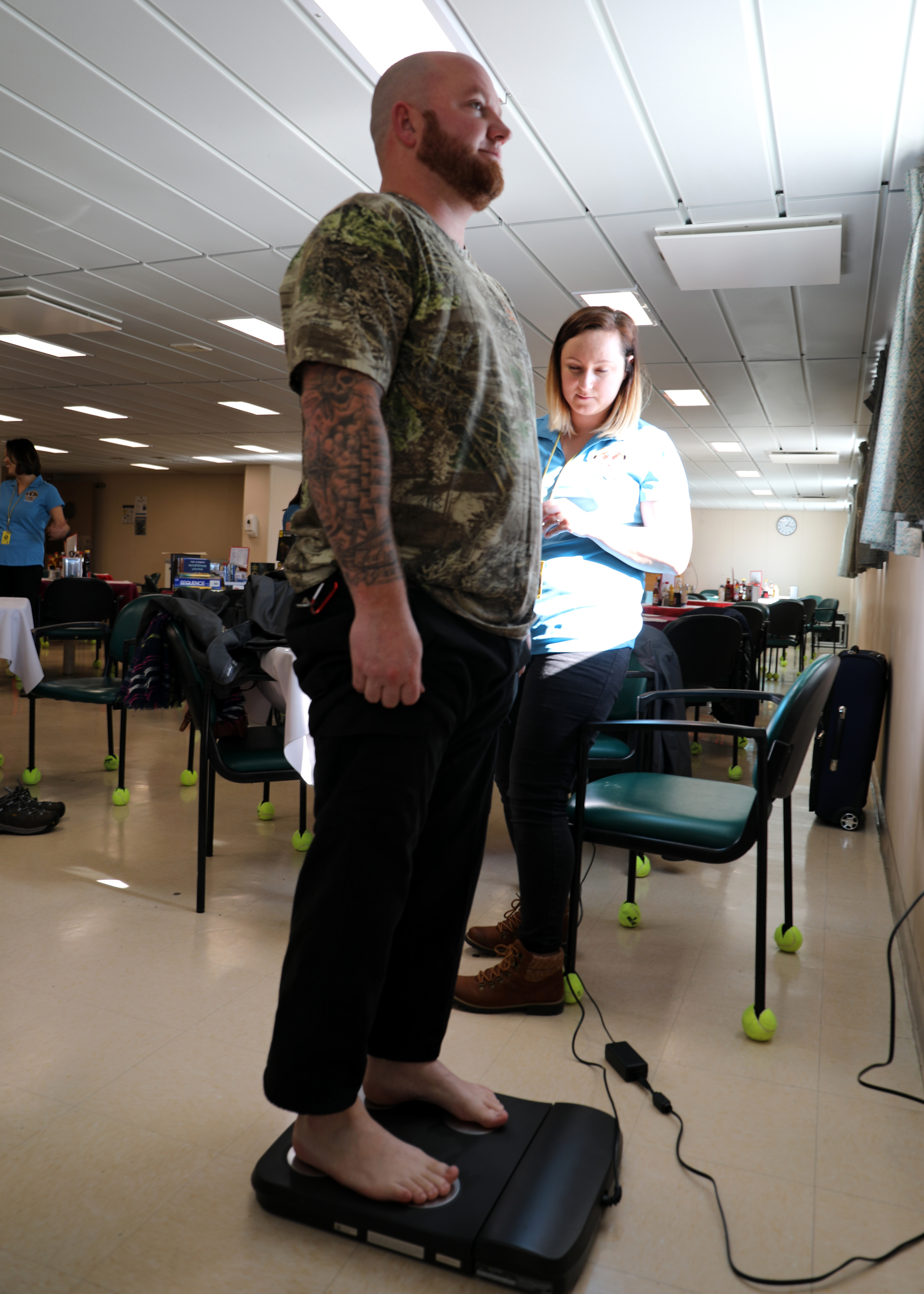Boatswain's Mate Mark Propst, a Civil Service Mariner aboard Military Sealift Command's dry cargo ammunition ship USNS William McLean (T-AKE 12), receives a voluntary body composition screening administered by Stephanie Rusnak, MSC Resiliency Team/Health Promotion Coordinator, while the ship was pier-side on Naval Station Norfolk, Jan. 13. The screening was part of the MSC The Resiliency/Health Promotion Team's visit to the ship to assist with crew resiliency aboard the ship.