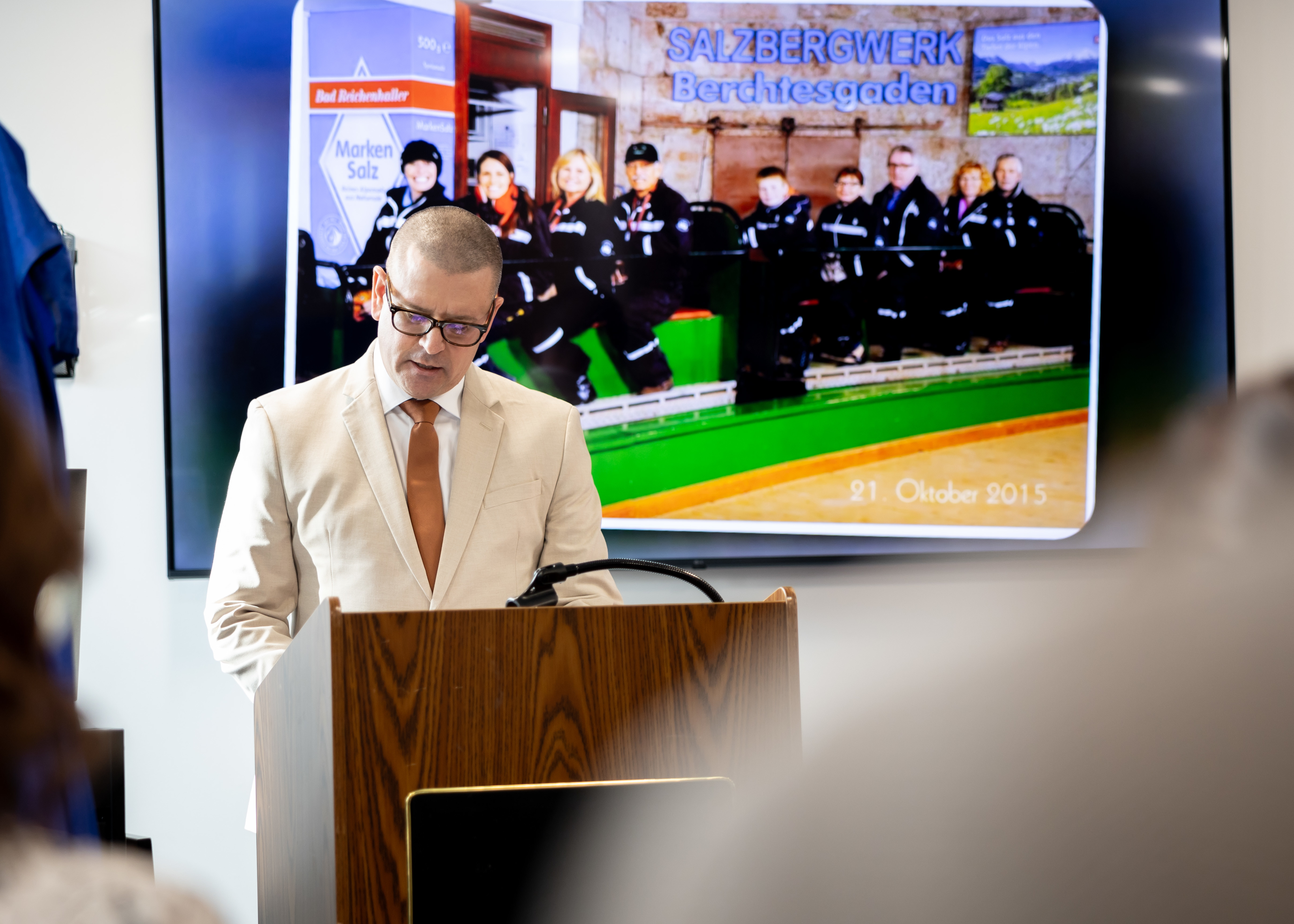 Michael Carlson, Rescue Swimmer Program Manager, Military Sealift Command, delivers the invocation during the Ron Law Small Arms Marksmanship Training Center (SAMTC) building dedication, held in the building Jan. 23, 2025. The building has been named after Ronald “Ron” Law, who dedicated 30 years of his life to Military Sealift Command as a Damage Control Officer and Small Arms Instructor.