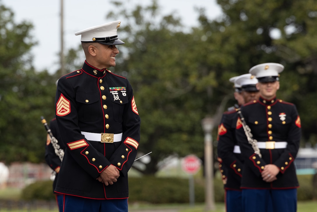 U.S. Marine Corps Staff Sgt. Carlos Ortiz IV, the musician technical assistant for 6th Marine Corps District, conducts the Parris Island Marine Band during the morning colors ceremony held at Marine Corps Recruit Depot Parris Island, South Carolina, March 8, 2024. Ortiz was given the opportunity to lead Marine musicians during the Parris Island’s morning colors ceremony, which is the traditional flag-raising ceremony of the American flag. (U.S. Marine Corps photo by Cpl. Tanner Pittard)