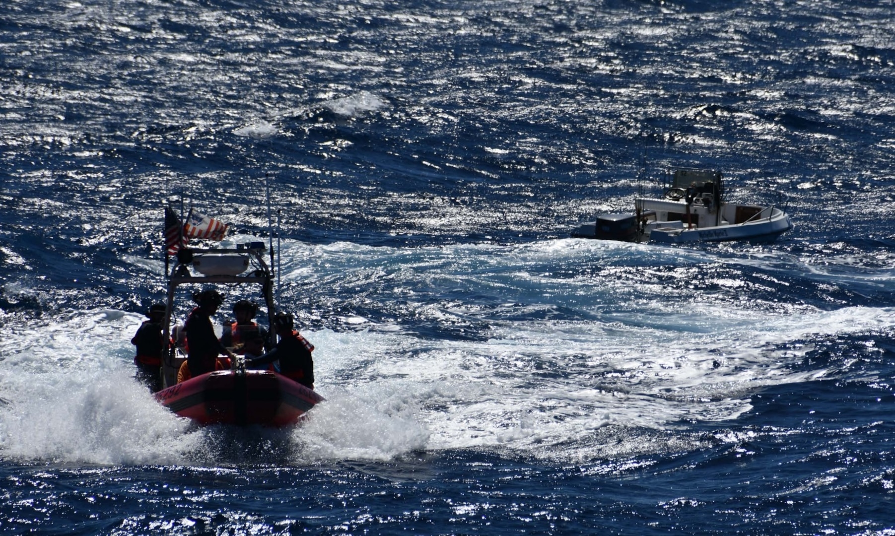 Coast Guard Cutter Joseph Napier crewmembers rescue five boaters from a disabled 18-foot vessel taking on water 13 nautical miles off Cabo Rojo, Puerto Rico, Feb. 1, 2025. The rescued boaters were later embarked aboard a responding commercial vessel and transported to ‘Combate’ Beach in Cabo Rojo, Puerto Rico; no injuries were reported in this case. (U.S. Coast Guard photo)