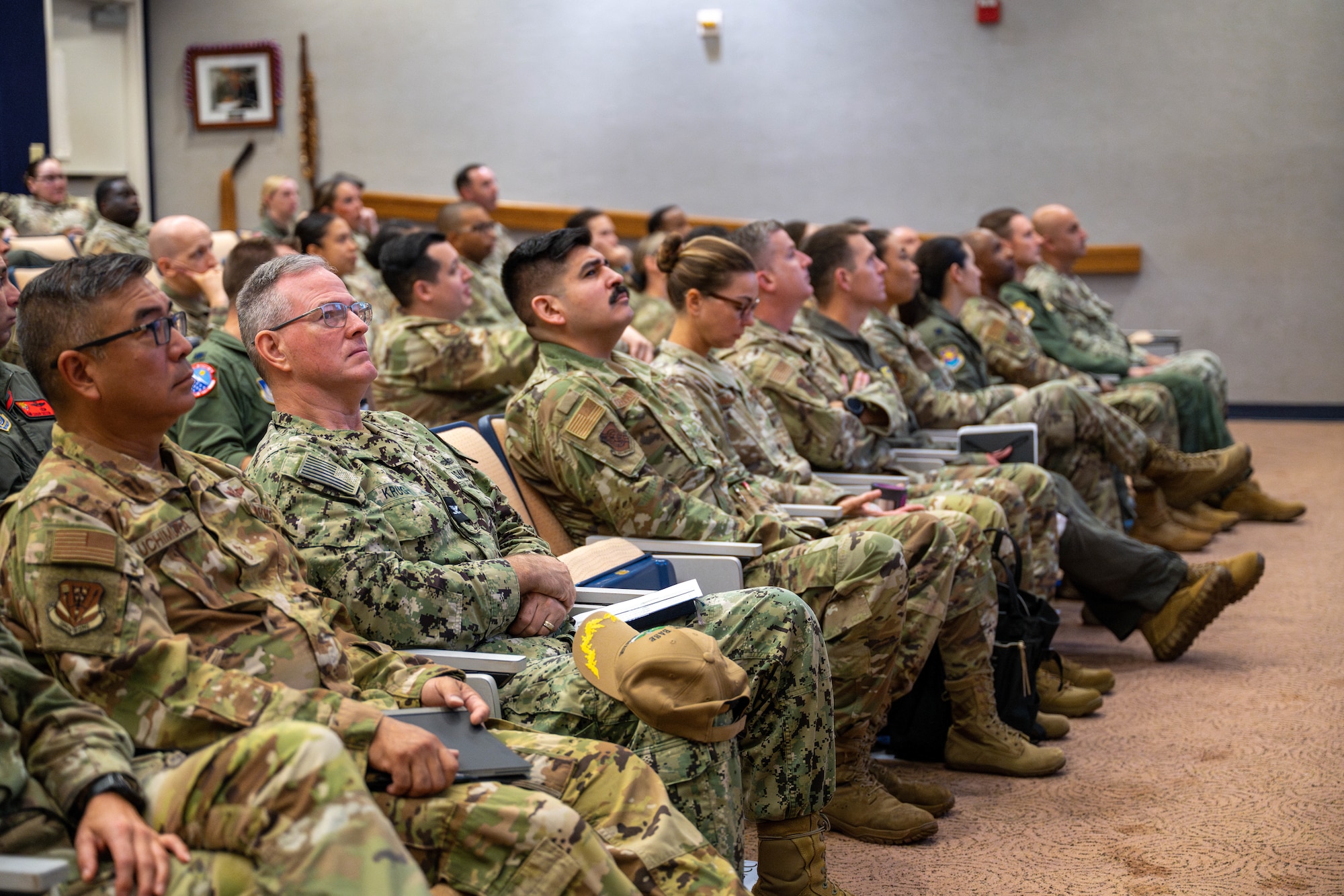 Servicemembers are sitting in the audience.
