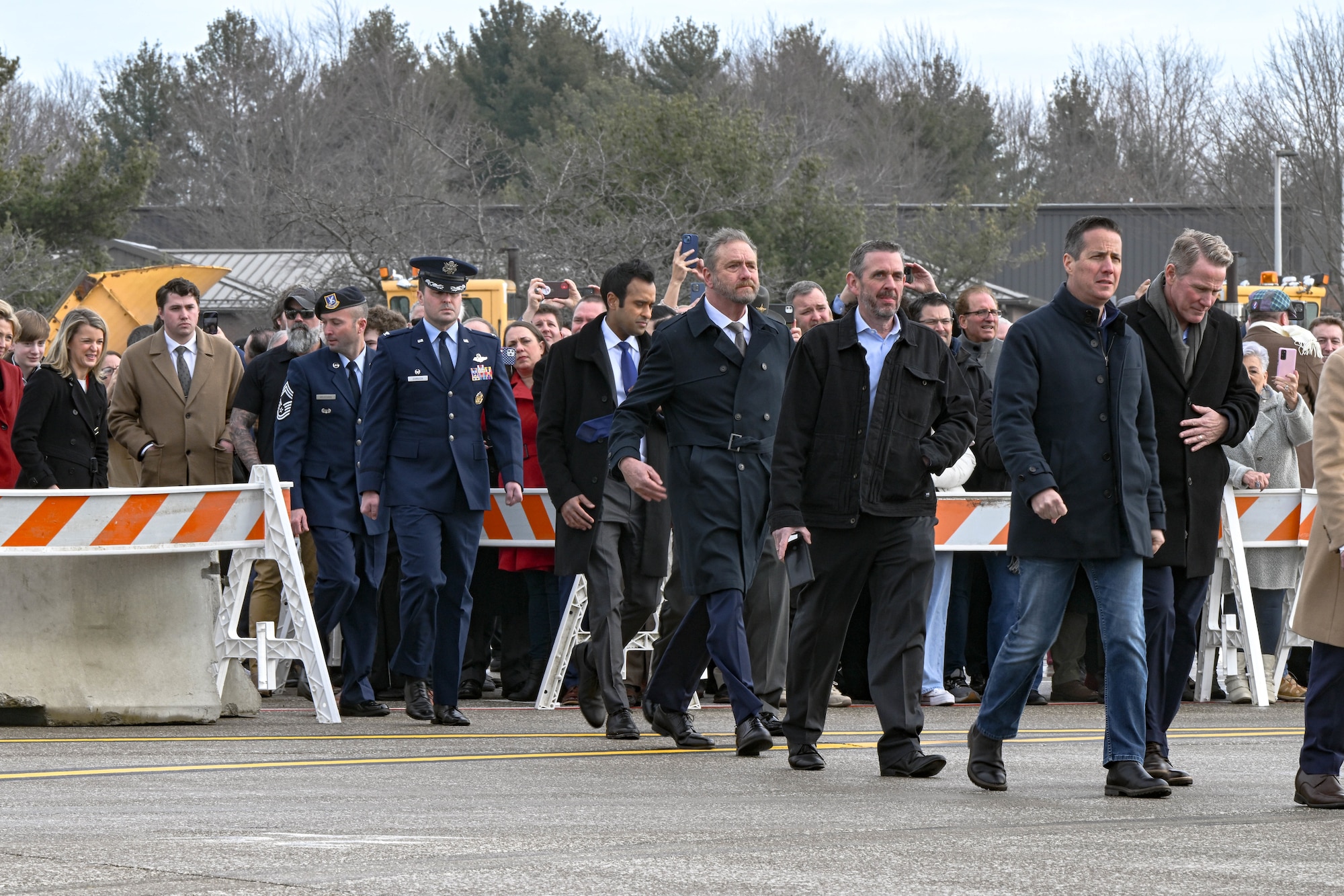 Senior leaders from 910th Airlift Wing and government officials walk towards Air Force Two, on Feb. 3, 2025, at Youngstown Air Reserve Station, Ohio.