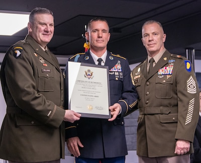 Brig. Gen. Lenny Williams, Assistant Adjutant General - Army, and Commander of the Illinois Army National Guard, and Command Sgt. Maj. Michael Kelly, State Command Sergeant Major, Illinois Army National Guard, presents Sgt. Maj. Chad Bell, 404th Maneuver Enhancement Brigade Operations Sergeant Major and Chief Operations Sergeant, with a certificate of retirement during a retirement ceremony Jan. 31 at The Barn at Bull Run Park in Morton.