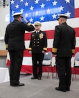 (left) Capt. David Back, outgoing Naval Surface Warfare Center Panama City Division commanding officer, relinquishes his command to Rear Adm. Todd Evans, commander, Naval Surface and Undersea Warfare, who served as the Naval Surface Warfare Center Panama City Division commanding officer change of command ceremony's presiding officer. (right) Capt. Paul Stence Jr. will serve as NSWC PCD’s 34th commanding officer. (U.S. Navy photo by Eddie Green)