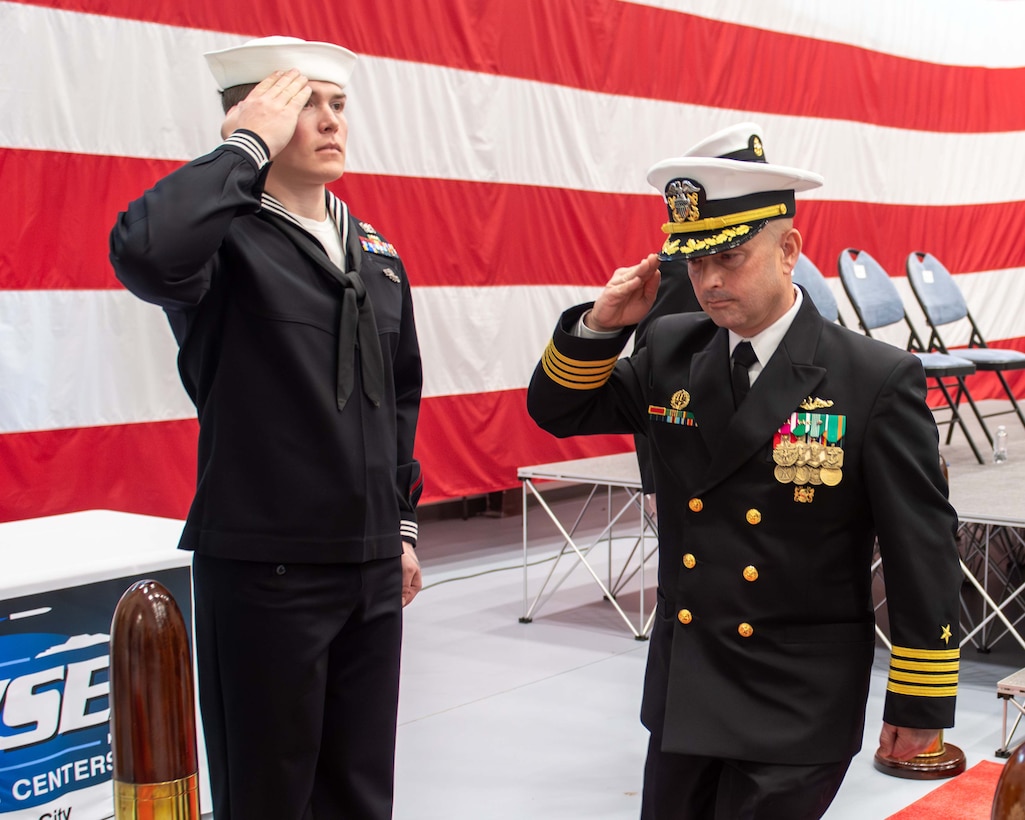 Capt. Paul Stence Jr., Naval Surface Warfare Center Panama City Division's newest commanding officer, salutes and exits at the conclusion of NSWC PCD's change of command ceremony held onboard Naval Support Activity Panama City, Fla., Jan. 31. NSWC PCD leads the Navy’s full spectrum research, development, test and evaluation, engineering, and fleet support of offensive and defensive systems in the littorals. (U.S. Navy photo by Eddie Green)
