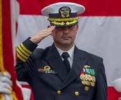 Capt. Paul Stence Jr. salutes during the playing of the national anthem during his change of command ceremony held onboard Naval Support Activity Panama City, Fla., Jan. 31. He will serve as NSWC PCD’s 34th commanding officer. (U.S. Navy photo by Eddie Green)