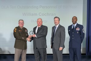 A man is honored during ceremony.
