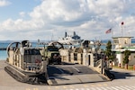 U.S. Marines with 31st Marine Expeditionary Unit, prepare to transport High Mobility Artillery Rocket System ammunition from an U.S. Navy landing craft, air cushion to the San Antonio-class amphibious transport dock ship USS San Diego (LPD 22) during onload operations at White Beach Naval Facility, Okinawa, Japan, Jan. 17, 2025.