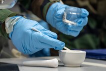 A U.S. Air Force Airman assigned to the 35th Civil Engineering Squadron office of emergency management demonstrates proper chemical, biological, radiological and nuclear (CBRN) procedures during a bilateral training.