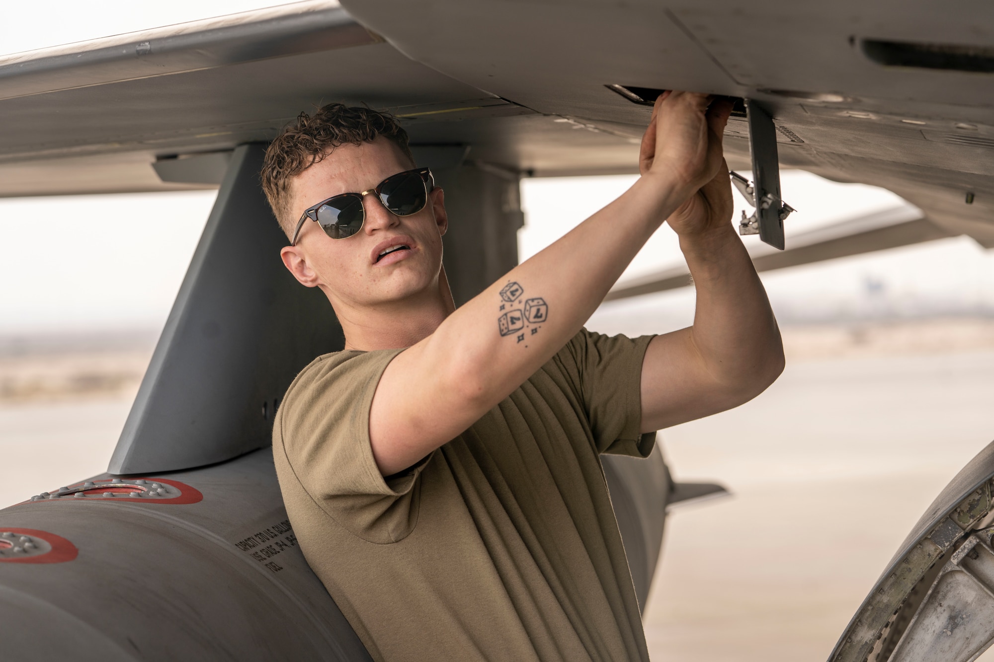 U.S. Air Force Airman 1st Class Garrett Holloway, 378th Expeditionary Maintenance Squadron assistant dedicated crew chief, recovers an F-16 Fighting Falcon during Exercise Spears of Victory, at King Abdulaziz Air Base, Saudi Arabia, Jan. 27, 2025.
