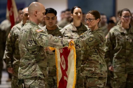 Alaska Army National Guard Col. Michele Edwards and Command Sgt. Maj. Russel Throckmorton, the commander and command sergeant major of the 297th Regional Support Group, case the unit colors during a deployment ceremony at the Alaska National Guard Armory on Joint Base Elmendorf-Richardson, Jan. 24, 2025. The Alaska Army National Guard’s Headquarters and Headquarters Company, 297th RSG, will deploy approximately 80 Guardsmen on a nine-month mission to Eastern Europe to support U.S. Army Europe and Africa’s Operation European Assure, Deter and Reinforce.