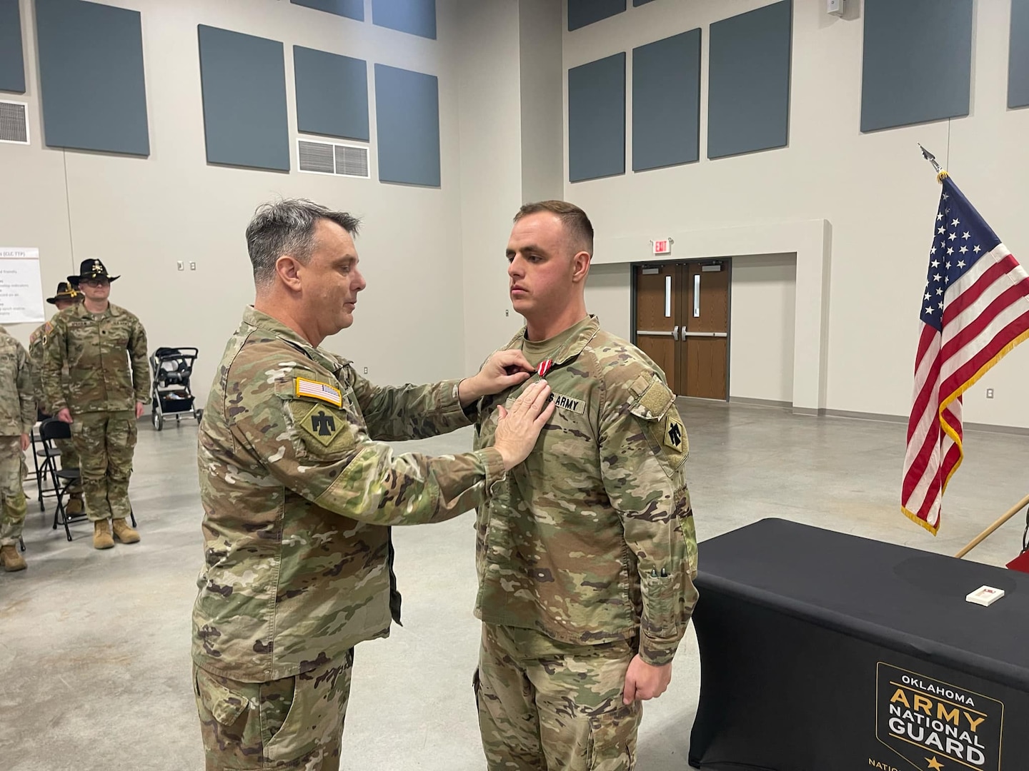 Maj. Gen. Thomas H. Mancino, adjutant general for Oklahoma, presents 2nd Lt. Gary Newberry, 1st Squadron, 180th Cavalry Regiment, with the Oklahoma Star of Valor at the 1-180th CAV's headquarters in Ardmore, Oklahoma, February 2, 2025, for Newberry's actions rescuing a driver from a burning vehicle on July 6, 2024. (courtesy photo provided by 1st Squadron, 180th Cavalry Regiment)