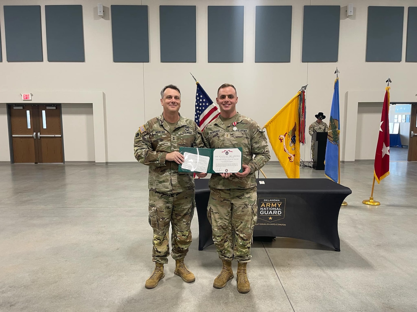 Maj. Gen. Thomas H. Mancino, adjutant general for Oklahoma, presents 2nd Lt. Gary Newberry, 1st Squadron, 180th Cavalry Regiment, with the Oklahoma Star of Valor at the 1-180th CAV's headquarters in Ardmore, Oklahoma, February 2, 2025, for Newberry's actions rescuing a driver from a burning vehicle on July 6, 2024. (courtesy photo provided by 1st Squadron, 180th Cavalry Regiment)