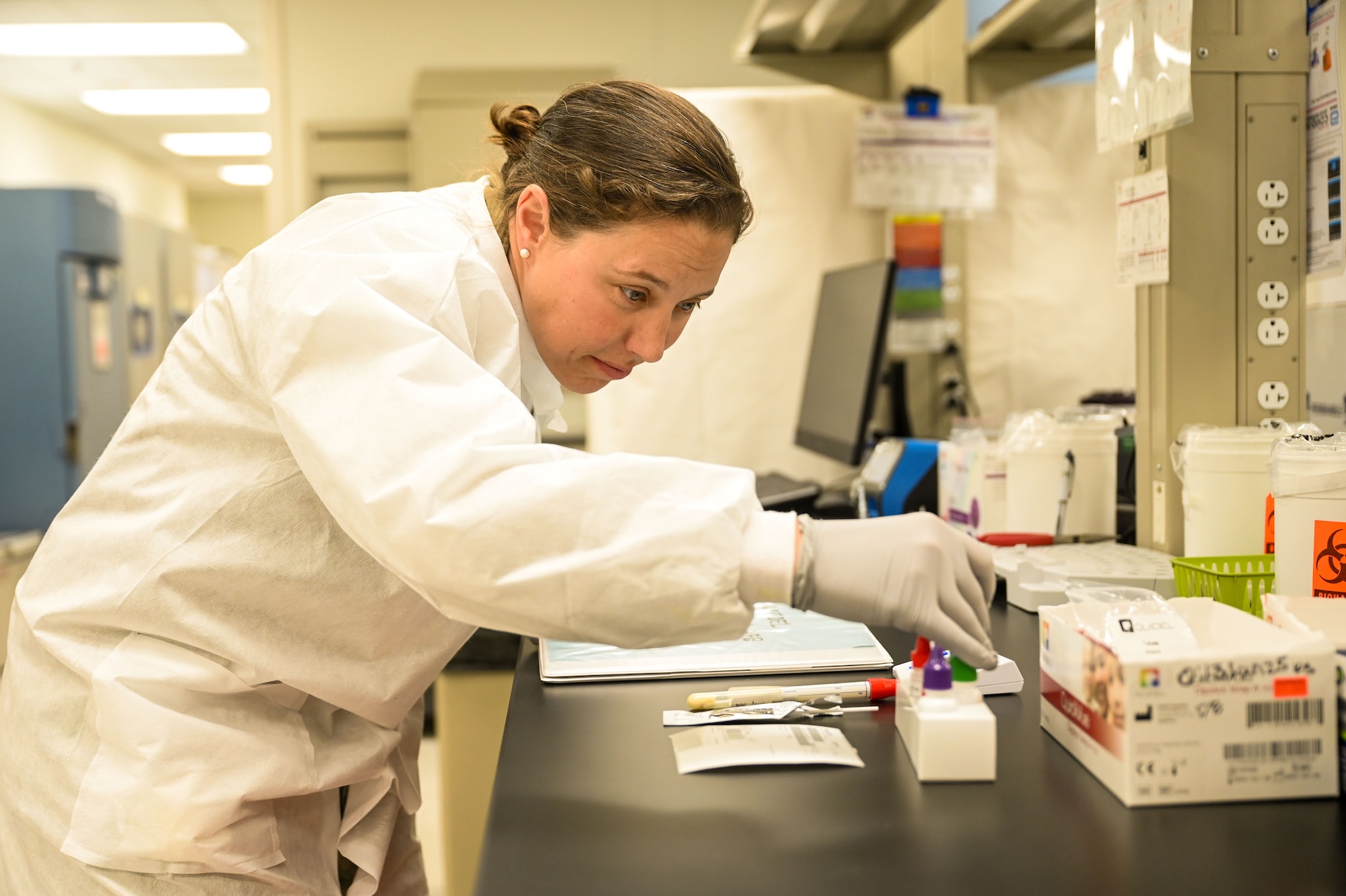 Tech. Sgt. Christina Swope, 90th Medical Group medical laboratory scientist, sorts through a tray of viles at F.E. Warren Air Force Base, Jan. 28, 2025. The biomedical laboratory is one of the 13 Air Force Specialty Codes within the Biomedical Science Corps, which is responsible for ensuring the care of military members. (U.S. Air Force photo by Airman 1st Class Mattison Cole)