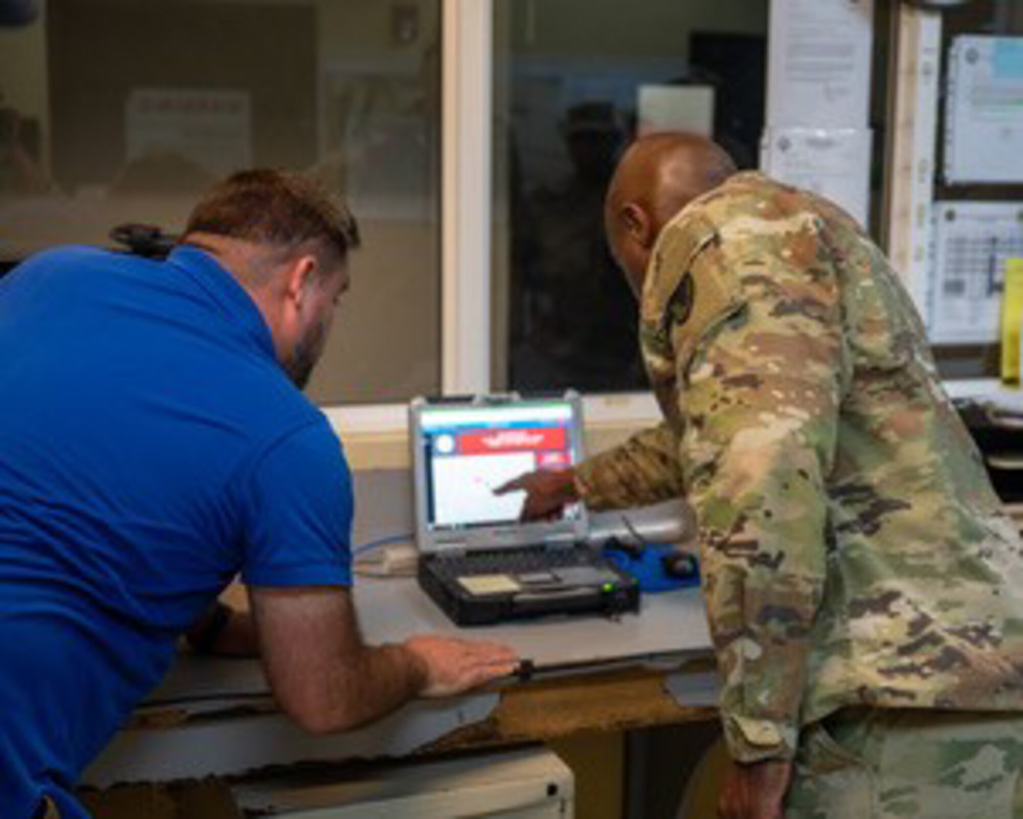 Nicholas Bennett, of the Axient IFRCO C-UAS MIST Team, provides Col. William Prince, commander of Army Support Activity at Soto Cano Air Base, January 21, 2025, with a demonstration on new drone detection capabilities.