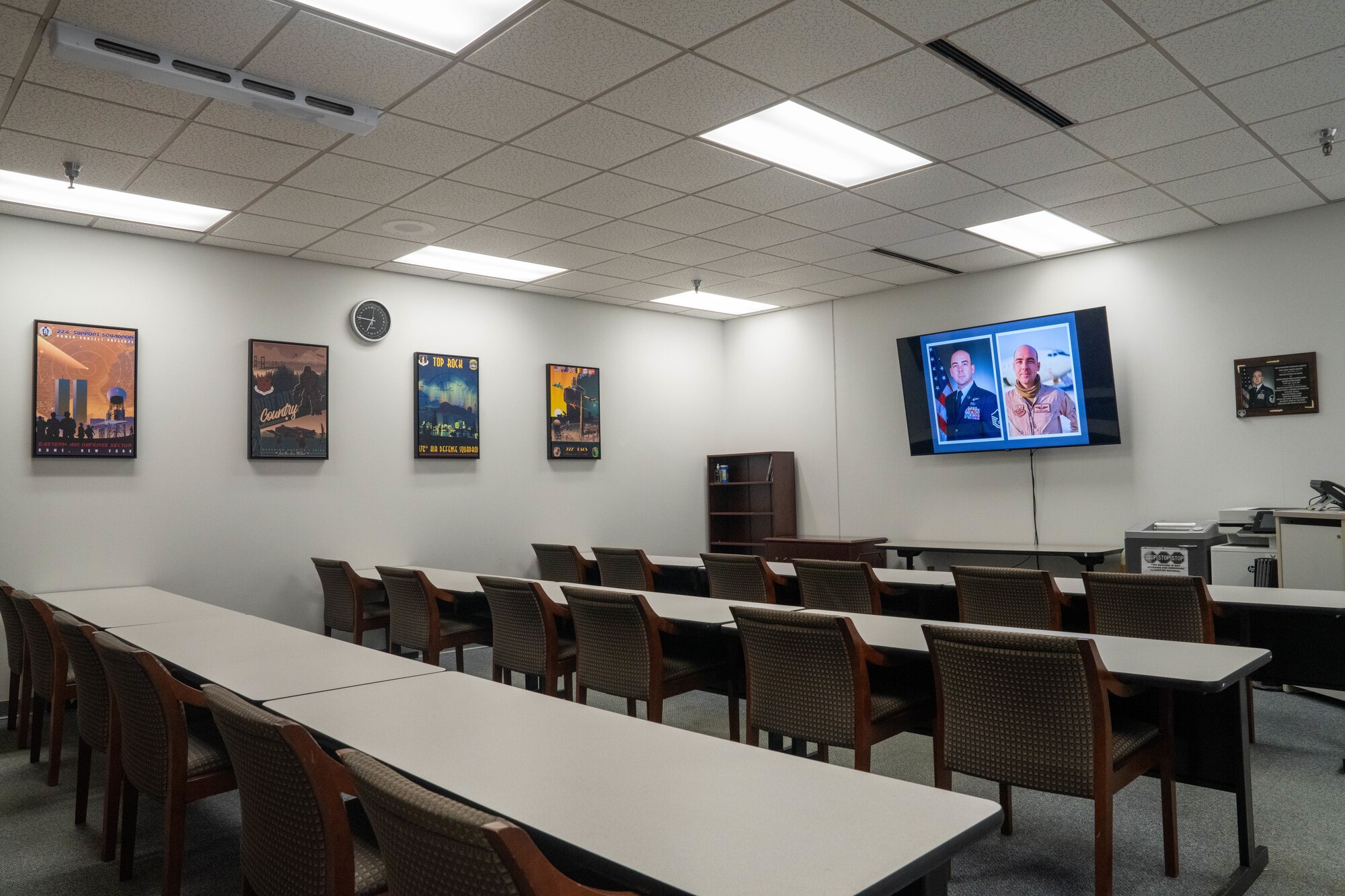 A slideshow honoring the late Master Sgt. Brian Baldwin, a former 330th CTS evaluator aviator, plays in a newly expanded training facility