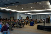 People speak on podium